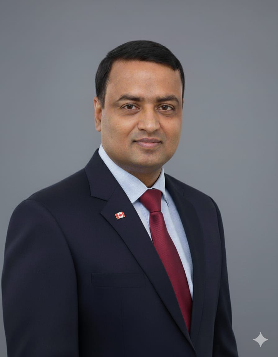 Iqbal Chowdhury wearing a suit and tie